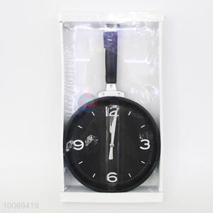 Black pan shaped plastic wall clock