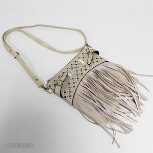 Recent design laser cut pu messenger bag with tassels