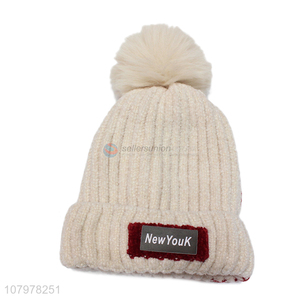 Low price kids autumn winter fleece lined beanie with faux fur pom pom