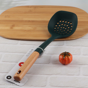 China imports durable nonstick silicone slotted ladle with wooden handle