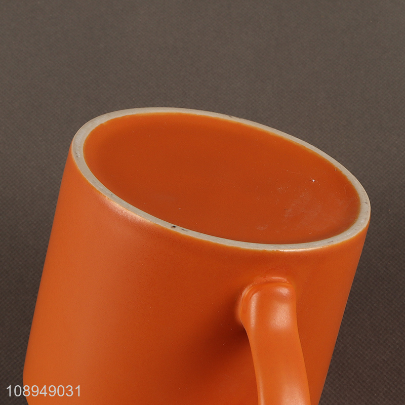 Low price orange ceramic water cup coffee cup with handle